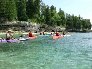 kayaking by door county bluffs