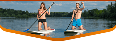 woman and man renting paddle boards