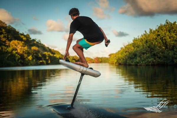 person riding on an efoil surfboard